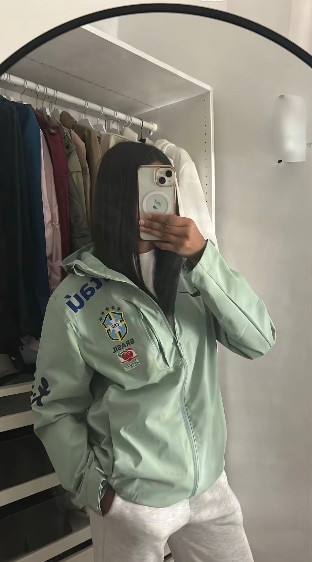 Light green jacket and beige trousers