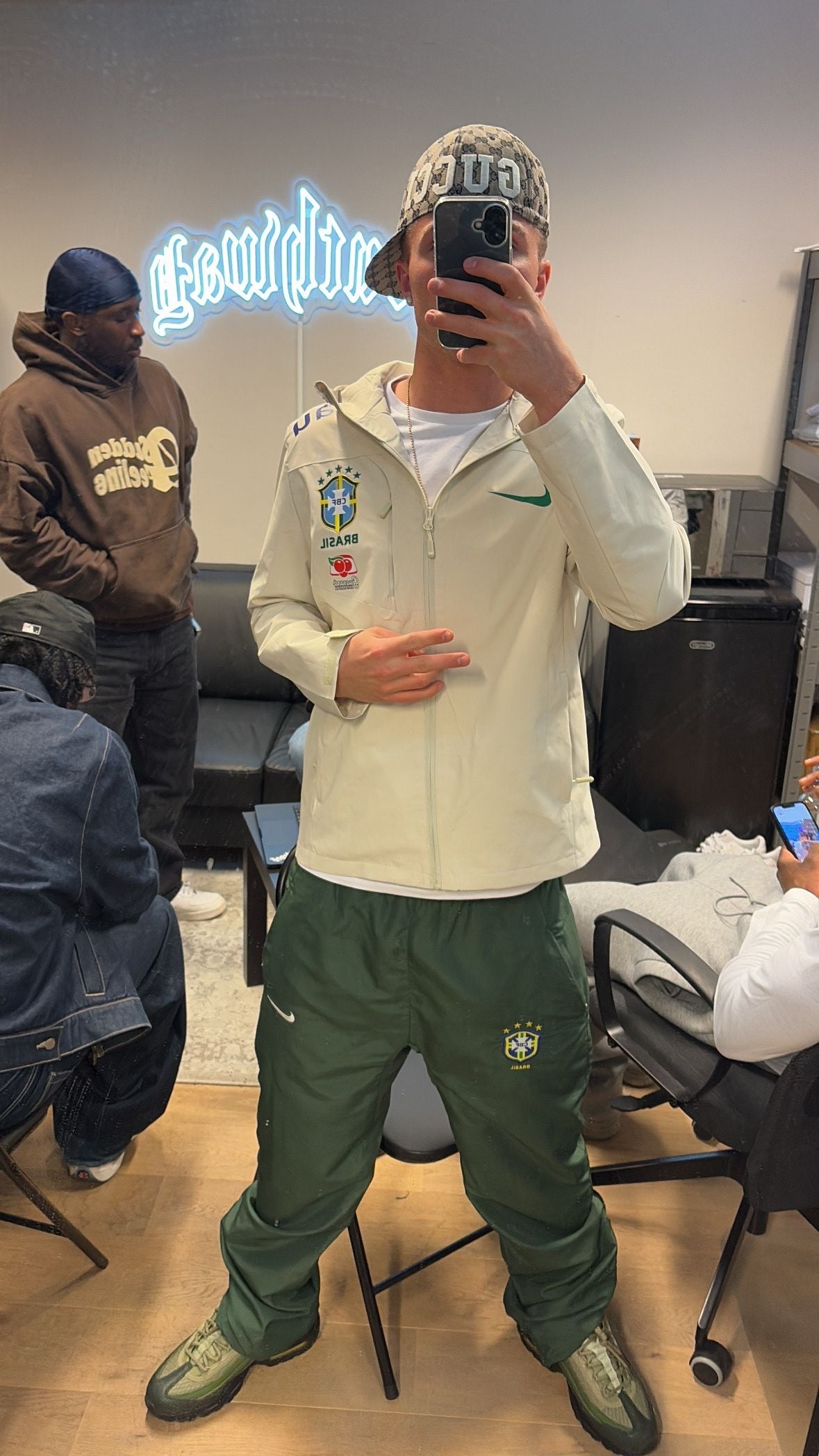 Ecru jacket and green trousers